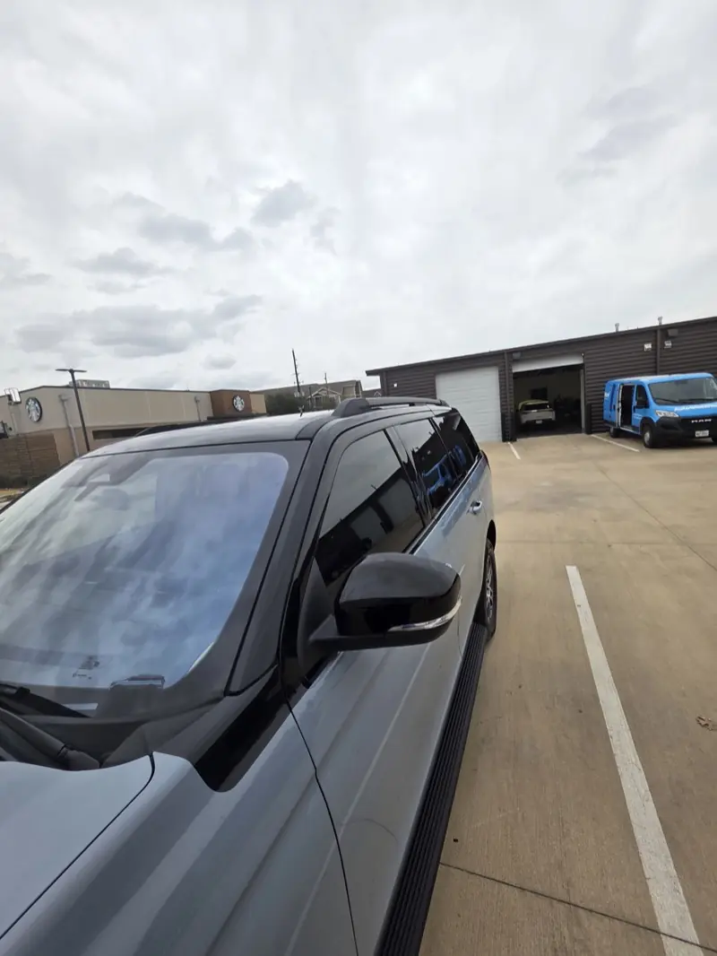Silver full-size SUV with window tint, at ExpressAutoTNT in Katy, TX