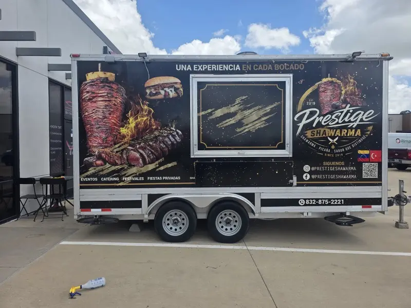 Side of a food trailer with a full printed wrap and a service window, Katy, TX