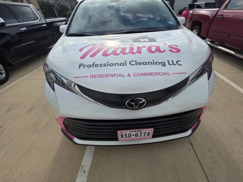 Front of a white minivan with a cleaning company’s hood graphics, by ExpressAutoTNT in Katy, TX