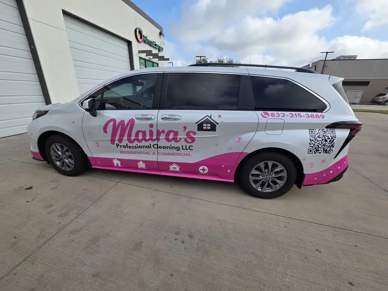 Side of a white minivan with pink cleaning-company graphics and a QR code, by ExpressAutoTNT in Katy, TX