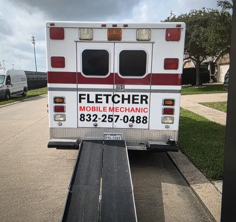 Rear doors of a box truck with mobile mechanic lettering, by ExpressAutoTNT in Katy, TX