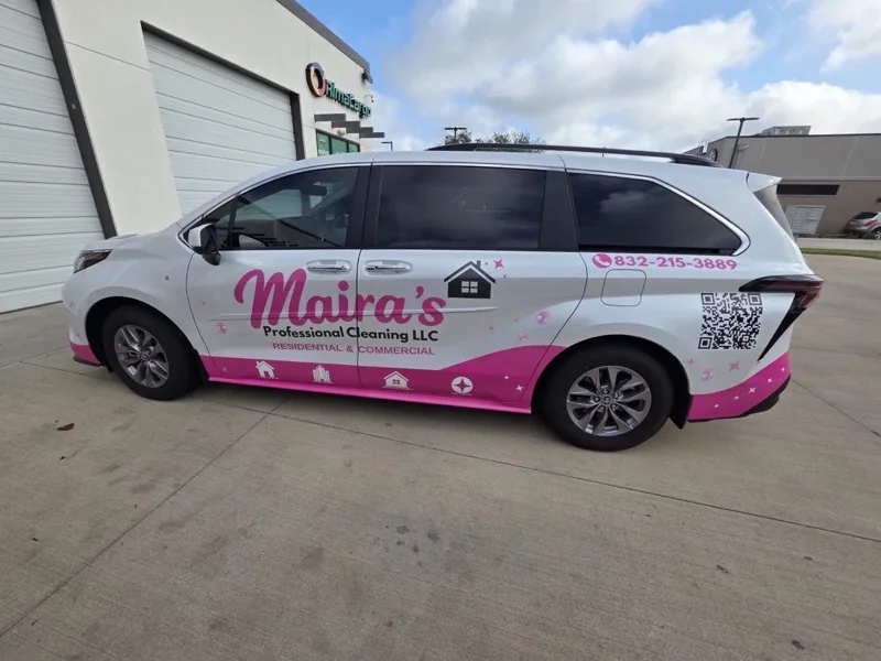 Minivan with pink cleaning company wrap